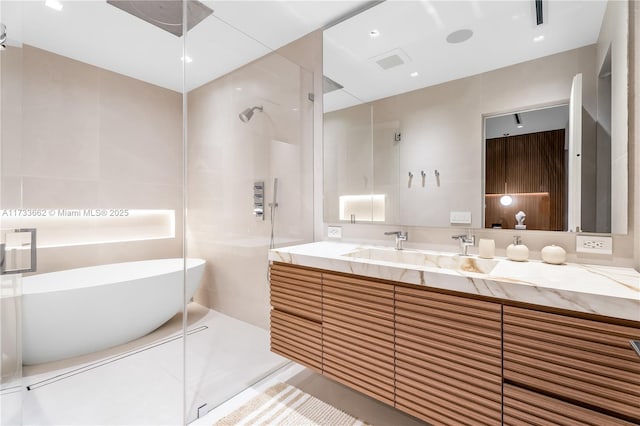 2415 San Domingo St, Coral Gables, FL 33134 - bathroom featuring a freestanding bath, visible vents, a walk in shower, and vanity