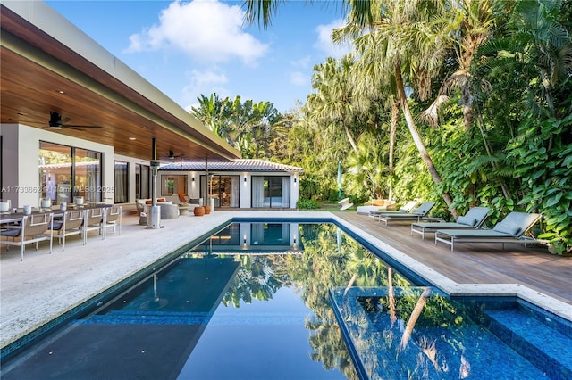 2415 San Domingo St, Coral Gables, FL 33134 - outdoor pool featuring a ceiling fan, outdoor lounge area, and a wooden deck