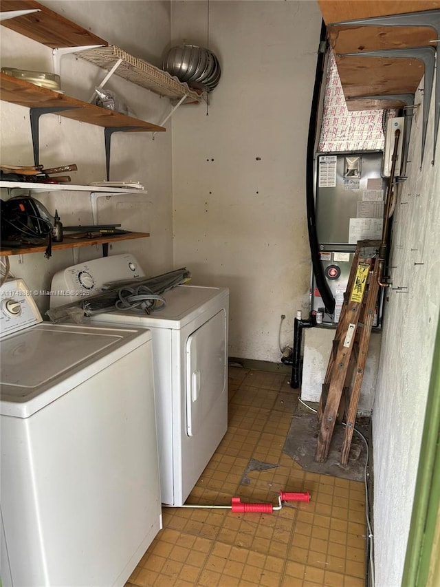 washroom with independent washer and dryer