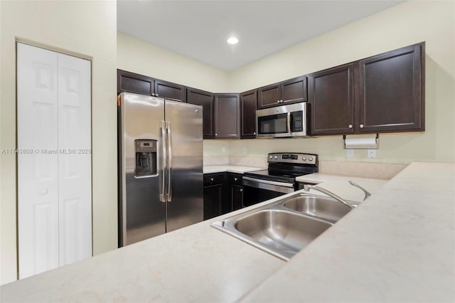 407 SE 32nd Ter, Homestead, FL 33033 - kitchen featuring sink, dark brown cabinets, and stainless steel appliances