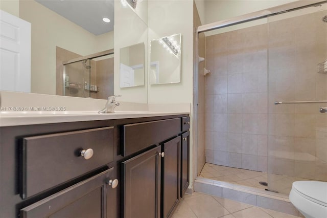 407 SE 32nd Ter, Homestead, FL 33033 - bathroom with vanity, toilet, an enclosed shower, and tile patterned flooring