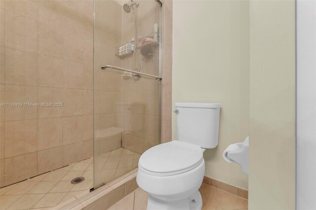 407 SE 32nd Ter, Homestead, FL 33033 - bathroom with a shower with shower door and toilet