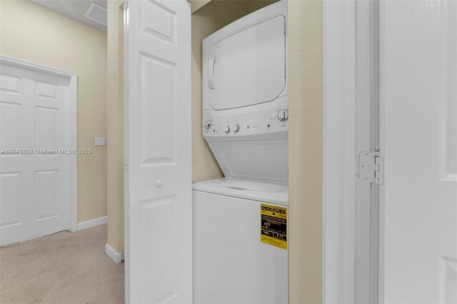 407 SE 32nd Ter, Homestead, FL 33033 - laundry room featuring stacked washing maching and dryer