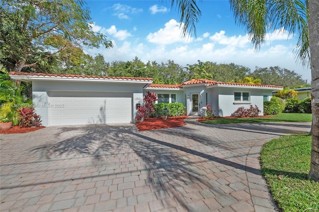 mediterranean / spanish-style house featuring a garage