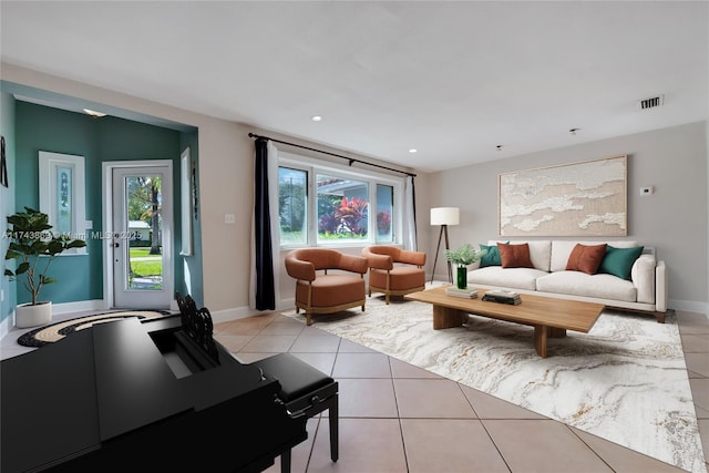 tiled living room featuring plenty of natural light