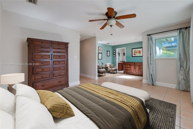 bedroom with light tile patterned floors and ceiling fan