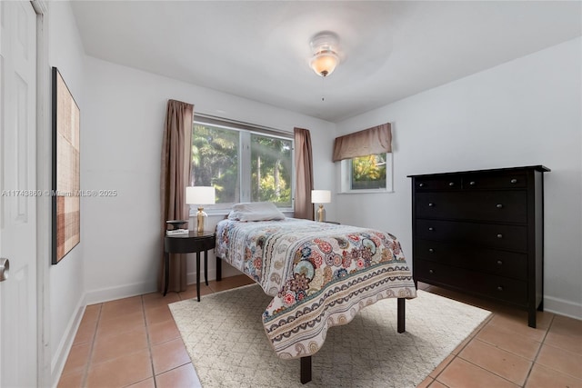 bedroom with light tile patterned flooring