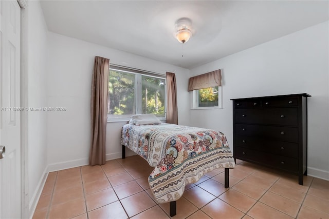 bedroom featuring light tile patterned floors