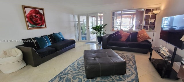 living room with french doors and light tile patterned floors