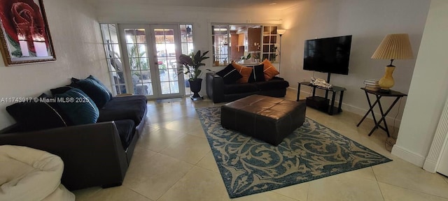 tiled living room featuring french doors