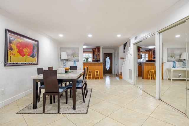 tiled dining area with ornamental molding