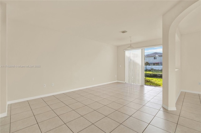 empty room featuring light tile patterned floors