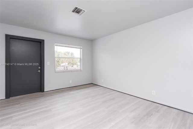 unfurnished room featuring light hardwood / wood-style flooring