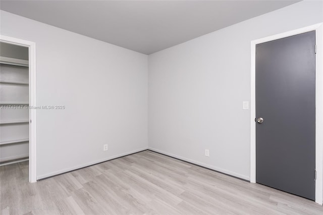 unfurnished bedroom with light wood-type flooring