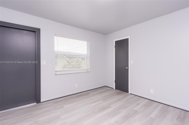 unfurnished bedroom featuring light hardwood / wood-style floors