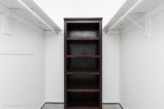 spacious closet featuring hardwood / wood-style flooring