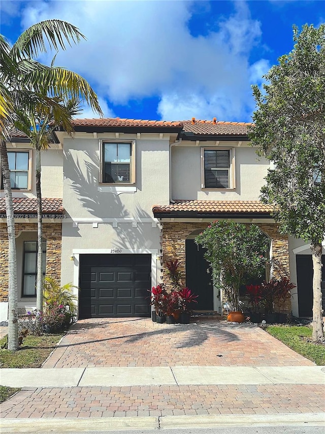 mediterranean / spanish-style home featuring a garage