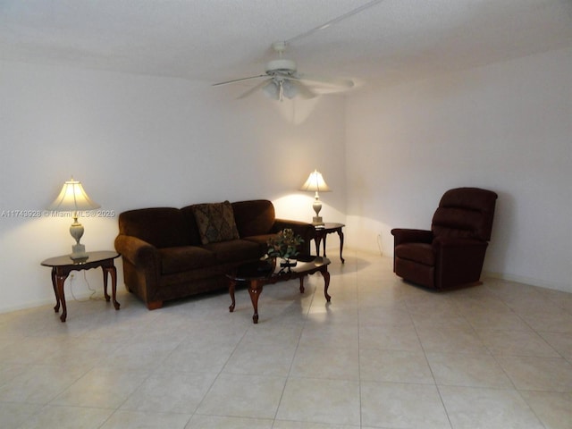 living room featuring light tile patterned floors and a ceiling fan