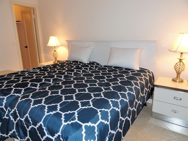 bedroom with light tile patterned floors