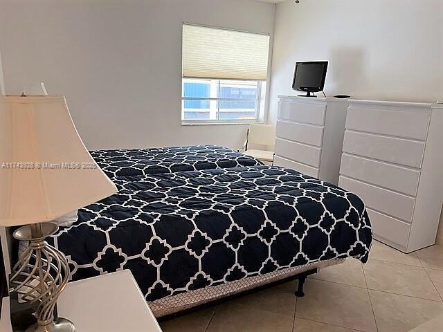 bedroom featuring light tile patterned floors