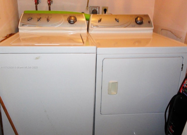 laundry area with laundry area and separate washer and dryer