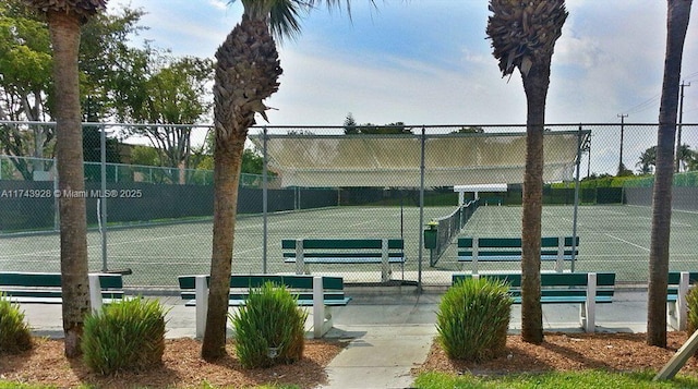 view of tennis court with fence