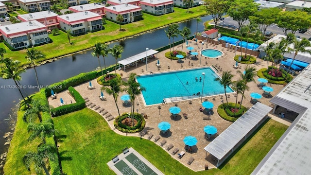 bird's eye view with a water view and a residential view