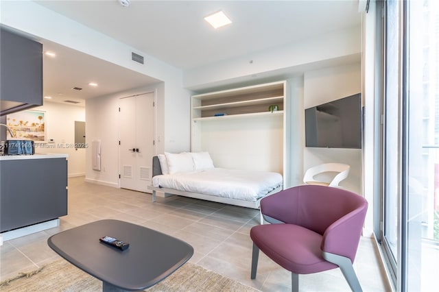 living room with light tile patterned floors