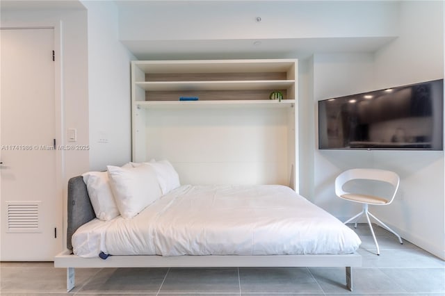 bedroom featuring light tile patterned floors