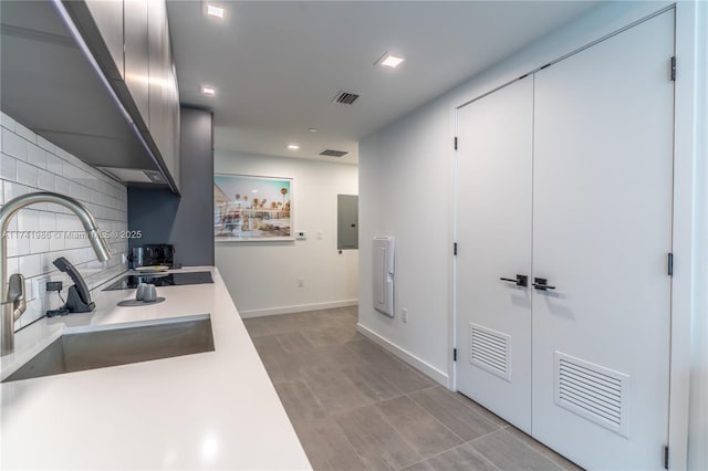 kitchen with tasteful backsplash and sink