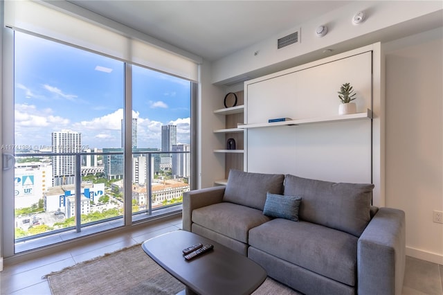 living room with light tile patterned floors and built in features