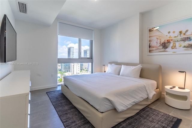 bedroom featuring a wall of windows