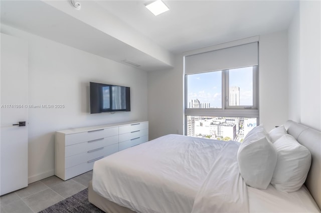 bedroom featuring light tile patterned floors