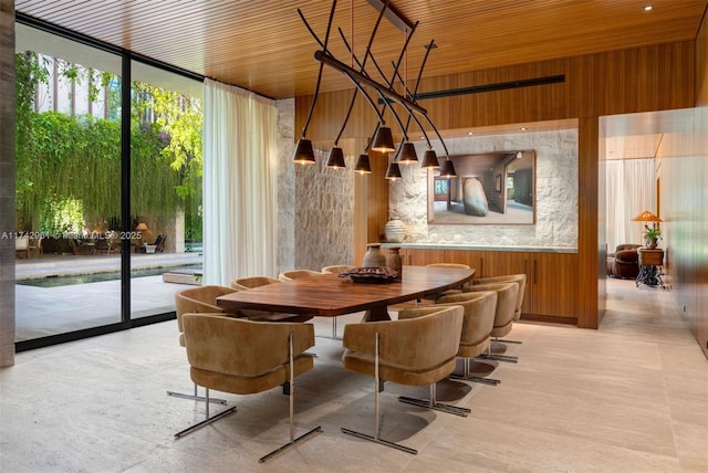 4725 Davis Rd, Miami, FL 33143 - dining room with wood ceiling, floor to ceiling windows, and wood walls