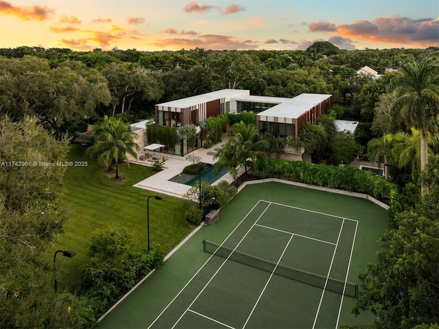 4725 Davis Rd, Miami, FL 33143 - view of tennis court featuring a lawn