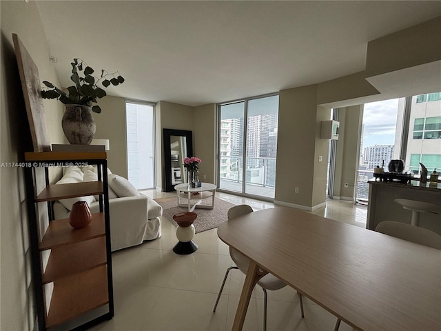 tiled living room with a wall of windows