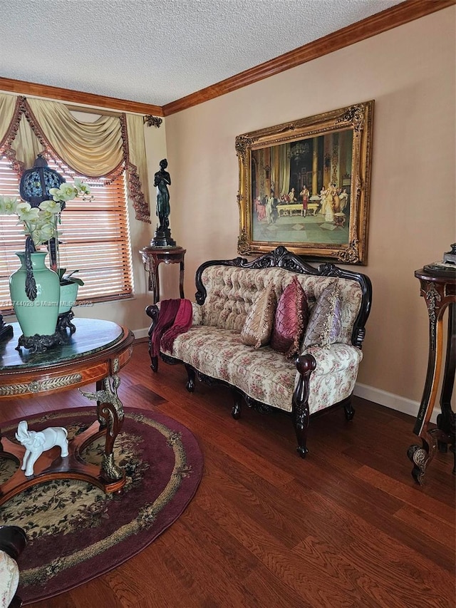 living room featuring dark wood-style flooring, crown molding, a textured ceiling, and baseboards