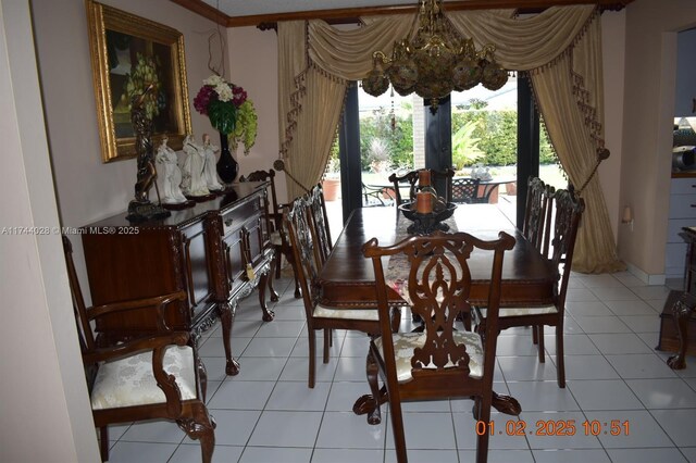 dining area with an inviting chandelier and light tile patterned floors