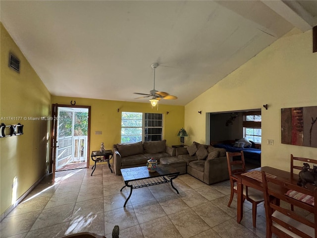 tiled living room featuring lofted ceiling and ceiling fan