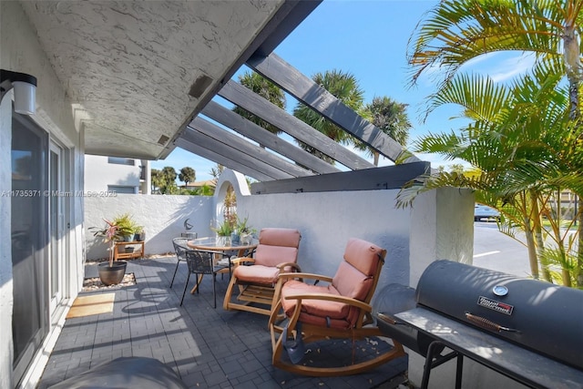 view of patio / terrace with a grill and a pergola