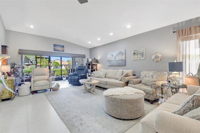 living room with vaulted ceiling, a wealth of natural light, and light tile patterned floors