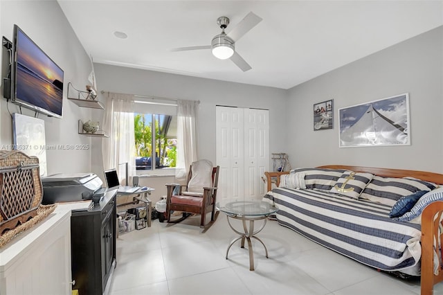 bedroom with ceiling fan and a closet