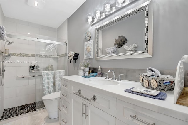 bathroom with vanity, an enclosed shower, and toilet