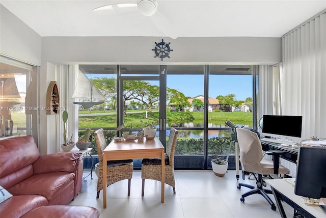 interior space featuring light tile patterned floors and ceiling fan