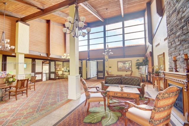 interior space with an inviting chandelier, wooden ceiling, beamed ceiling, and ornate columns