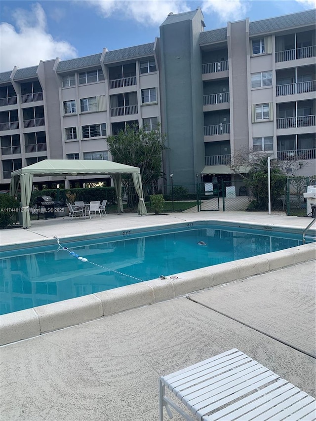 view of swimming pool with a gazebo and a patio