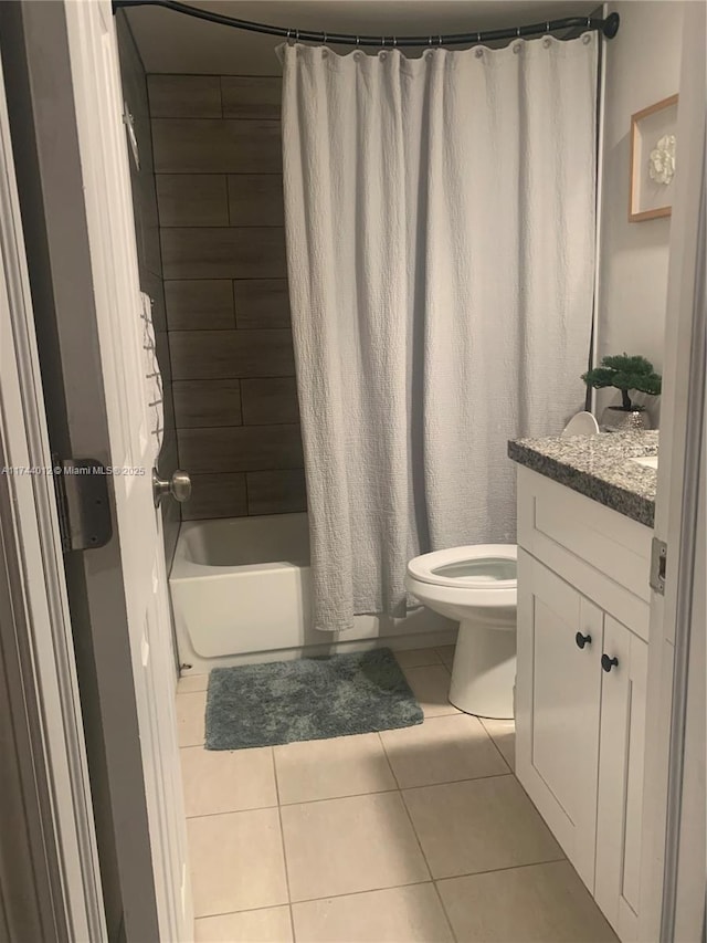 full bathroom featuring vanity, toilet, tile patterned floors, and shower / bath combo with shower curtain