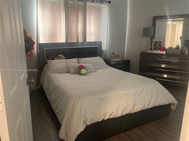 bedroom featuring dark wood-type flooring