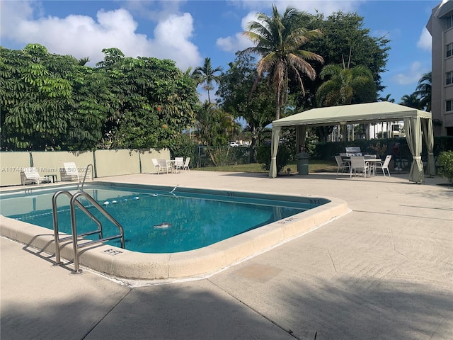 view of pool featuring a gazebo and a patio