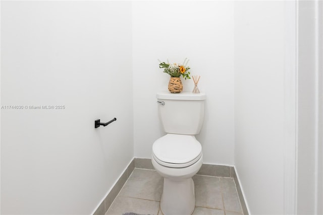 bathroom with tile patterned flooring and toilet